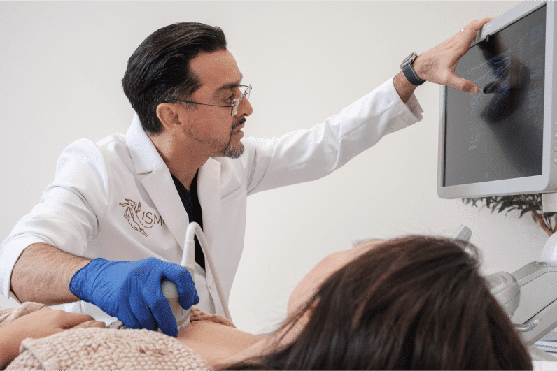 Doctor performing breast ultrasound at ISMI Montreal Private Clinic